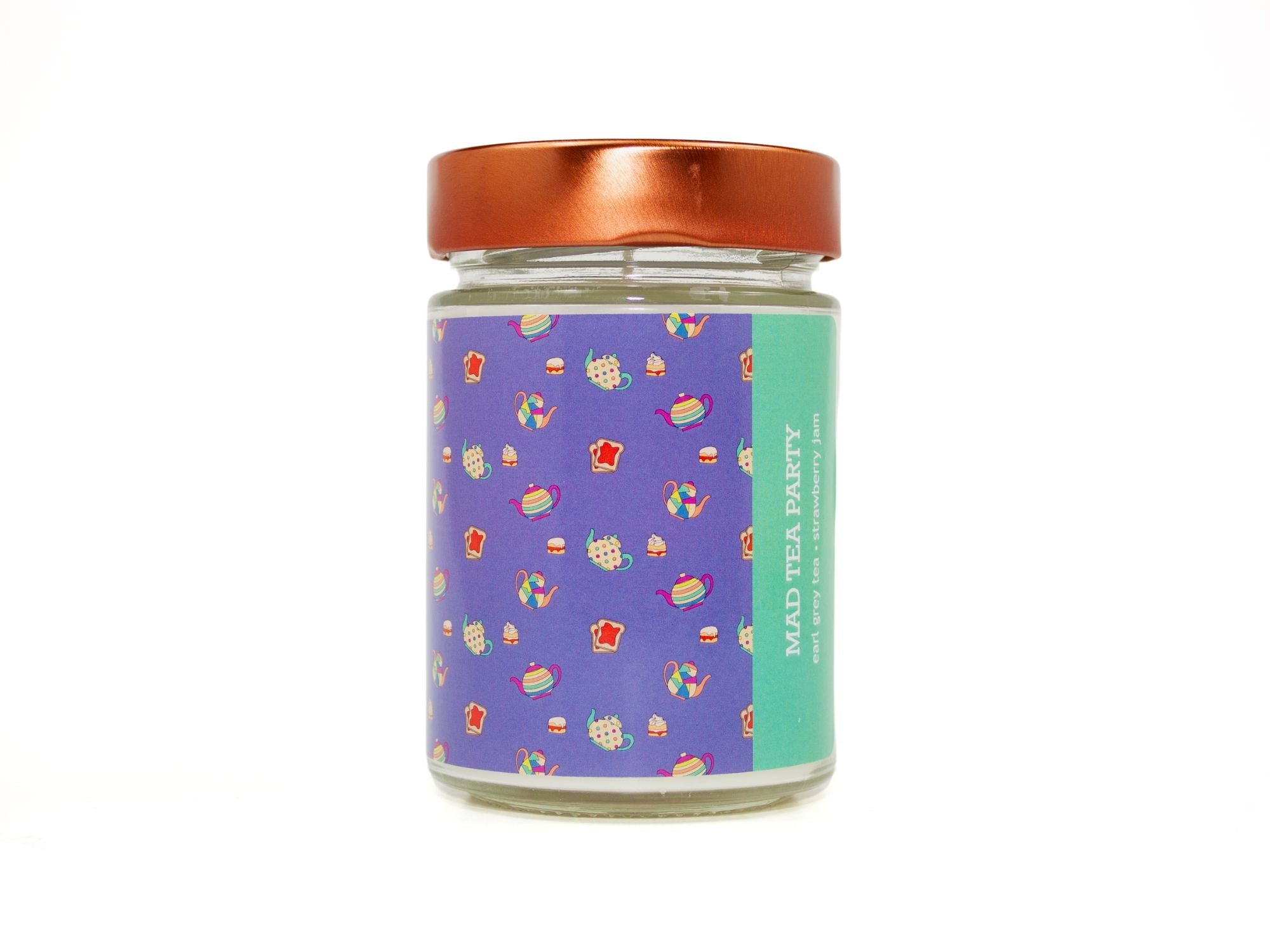 Onset & Rime earl grey tea scented candle called "Mad Tea Party" in a 10 oz glass jar with copper lid. The label is purple with a pattern of teacups, cakes and toast with strawberry jam. The text on the label is "Mad Tea Party - Earl Grey Tea, Strawberry Jam".