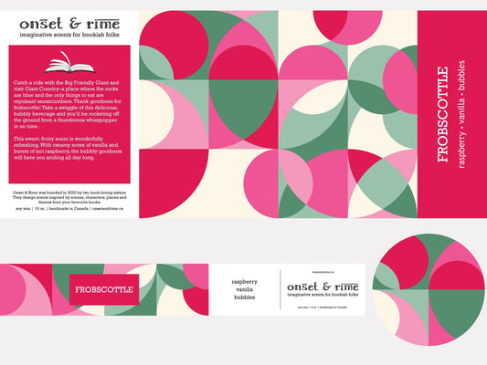 A close up view of the label for the Onset & Rime fruity soda scented candle called "Frobscottle". The label is a geometric pattern of overlapping pink, white and green circles and squares. The text on the label is "Frobscottle - Raspberry, Vanilla, Bubbles".